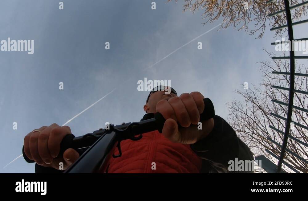 Cool man riding a kick scooter with swag in the woods, pov low angle