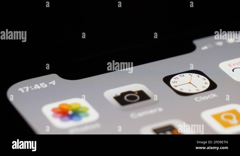 Extreme close up shot of clock app ticking and showing the real time