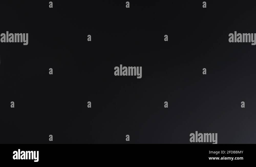 Slow pan over a microphone condenser mic sensitive recording dark