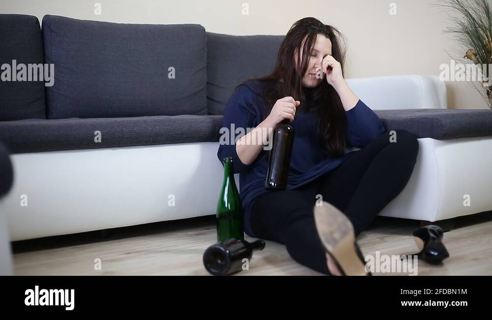 Drunk Woman Lying On The Sofa With Kind Of Wine Bottles Alcoholism Concept Stock Video Footage 