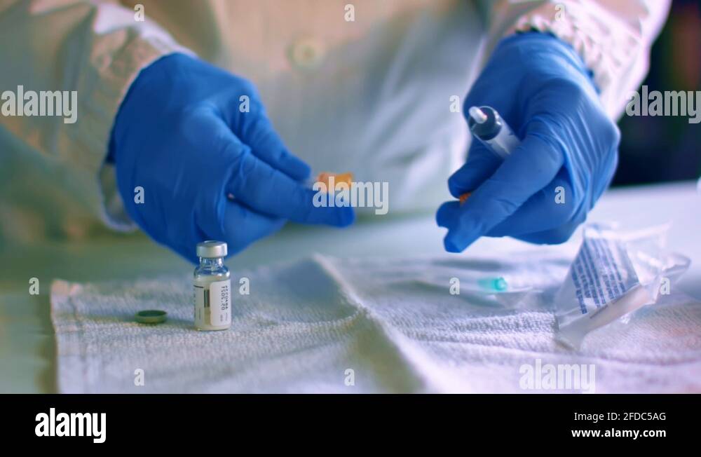 Nurse assemble needle of a syringe for injection Stock Video Footage Alamy