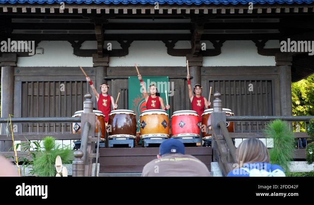 Three Japanese women playing large drums at the Japanese Pavilion in Epcot Stock Video Footage