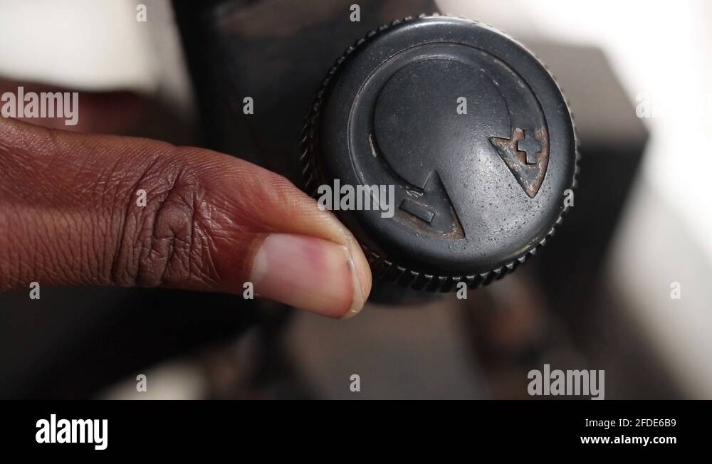 adjusting the tension on an exercise bike Stock Video Footage Alamy