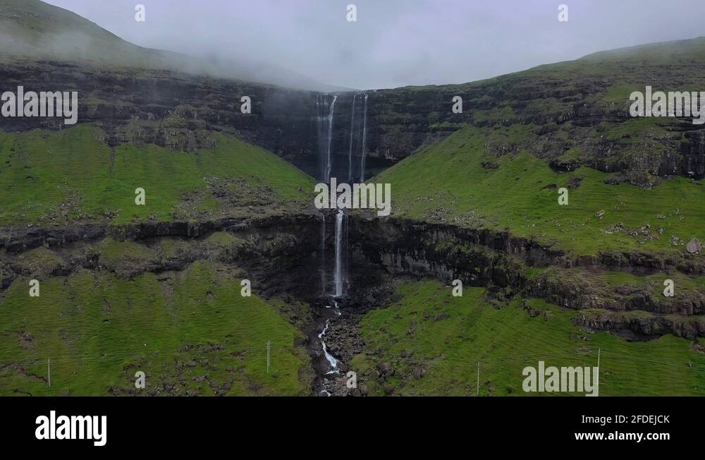 Misty Fossá Waterfall, tallest waterfall in Faroe Islands, aerial misty ...