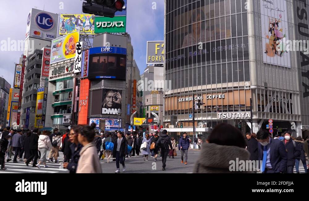 The Famous Busy Pedestrian Crossing In Shibuya Tokyo Japan In Daytime ...