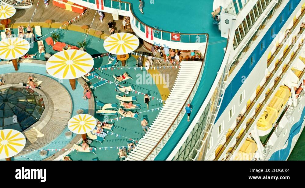 Aerial Zoom of People Tanning and Relaxing on a Cruise Ship Liner Stock ...