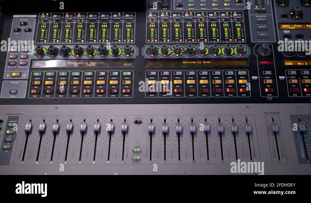 A Colorful Sound Music Mixer Adjusting Volume Faders Rapidly and Flashing Stock Video Footage