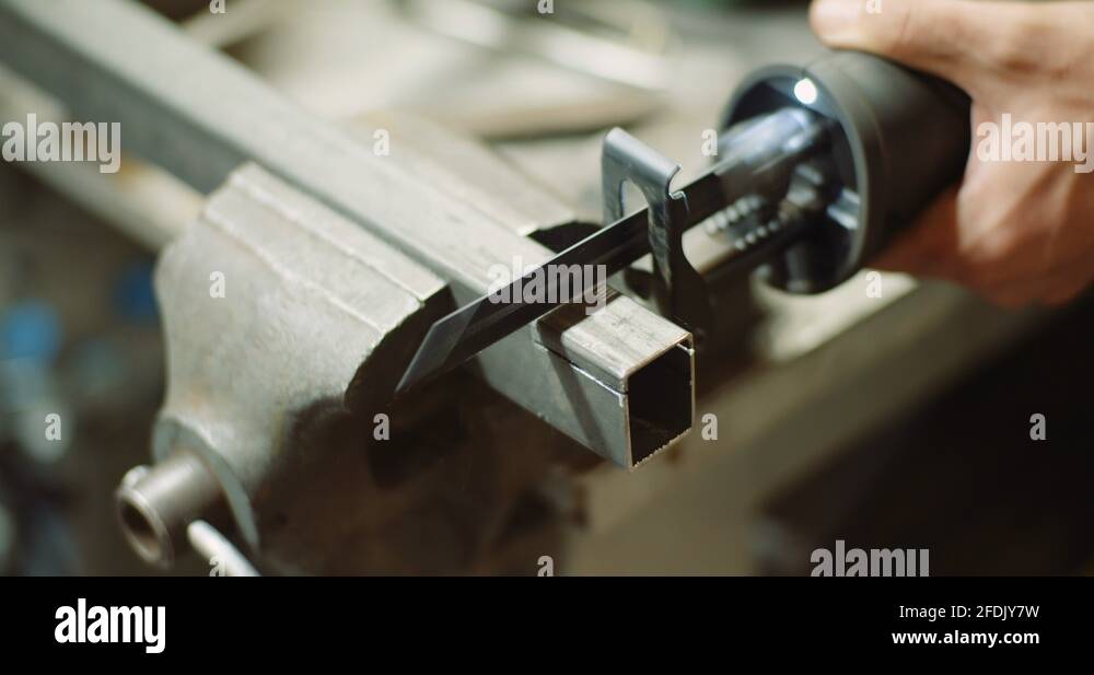 industry worker metal part with electric hacksaw Stock Video Footage Alamy