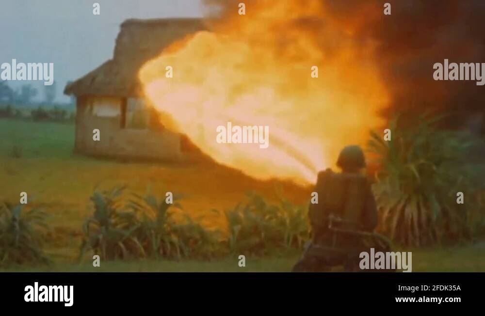 Marines with a flamethrower burn houses. Vietnam war 1967 Stock Video