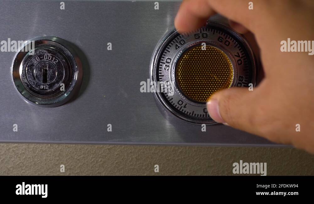 Man hand Opening old safe combination lock turning dials Stock Video