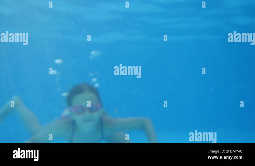 Little girl swimming underwater in the pool Stock Video Footage - Alamy
