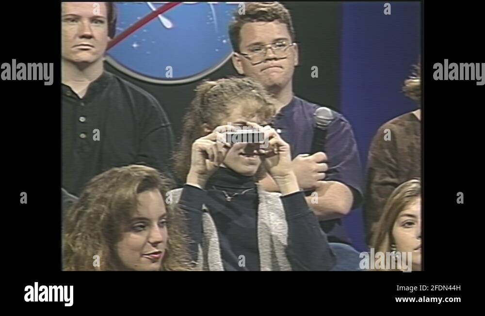 1990s: student looking through spectroscope, 1990s: host has student ...