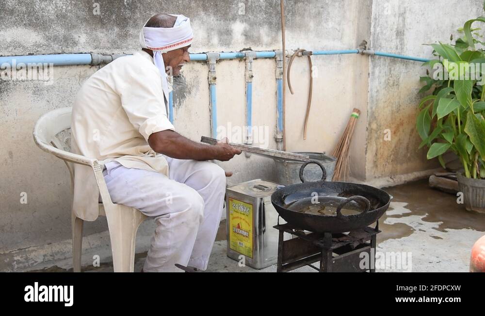 Vendors making Indian street food or festival snacks (Diwali Snacks