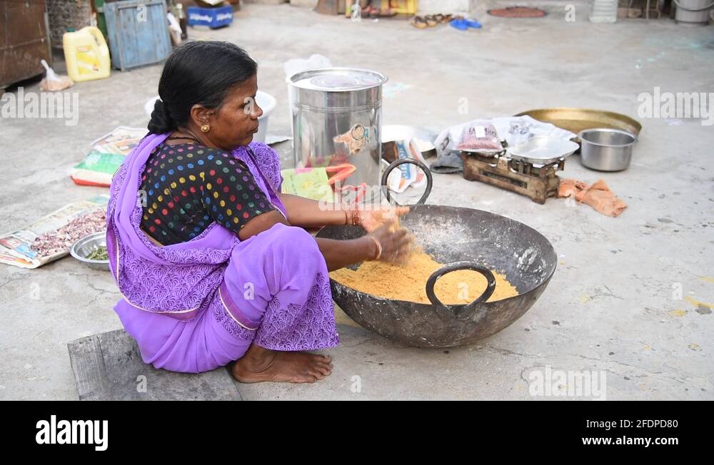 Vendors making Indian street food or festival snacks (Diwali Snacks