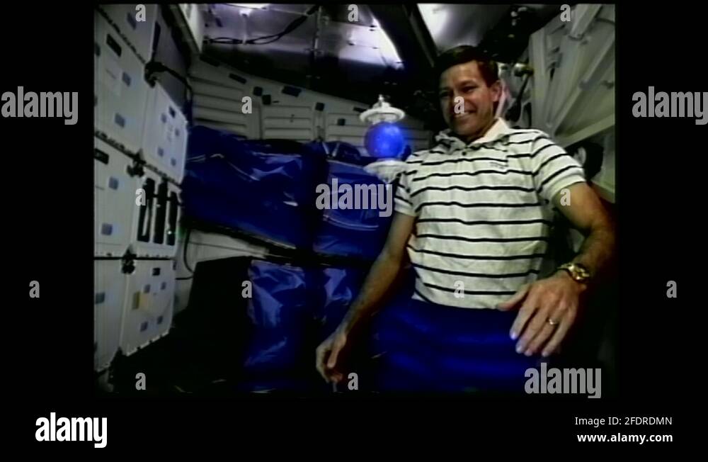 1990s astronaut floating in zero gravity gestures, bumps floating