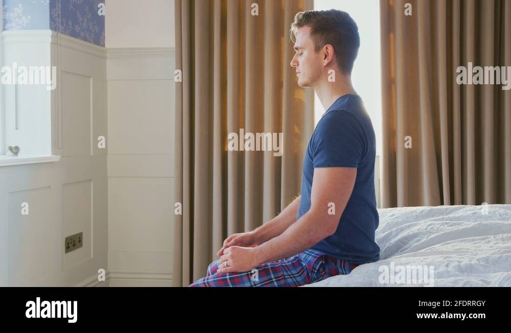 Men sitting on edge bed Stock Videos & Footage HD and 4K Video Clips