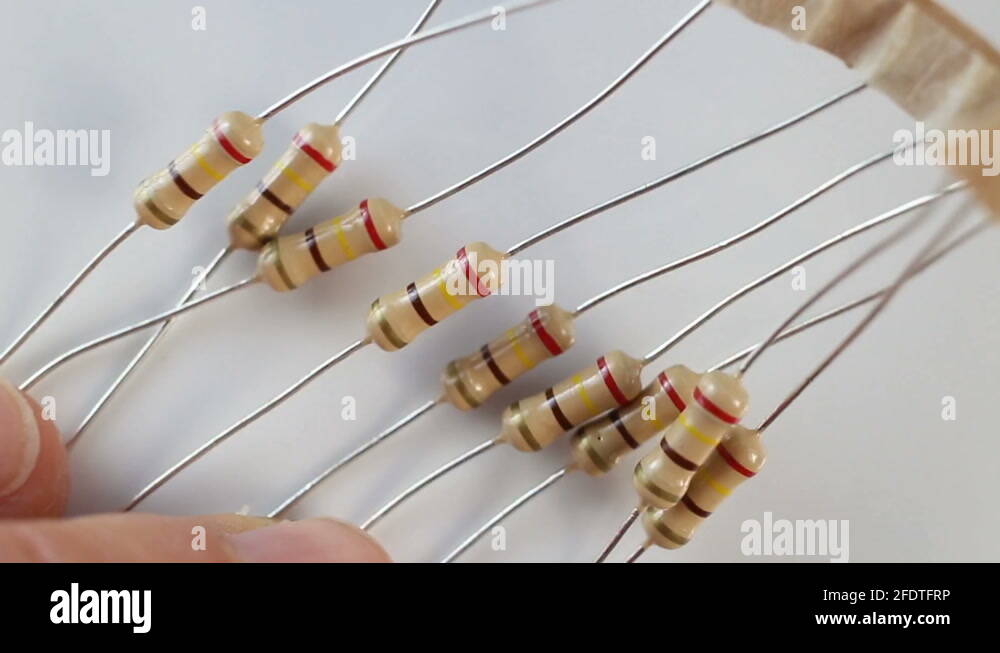 fixed (fixedvalue) permanent resistor on a white background. Extreme closeup Stock Video