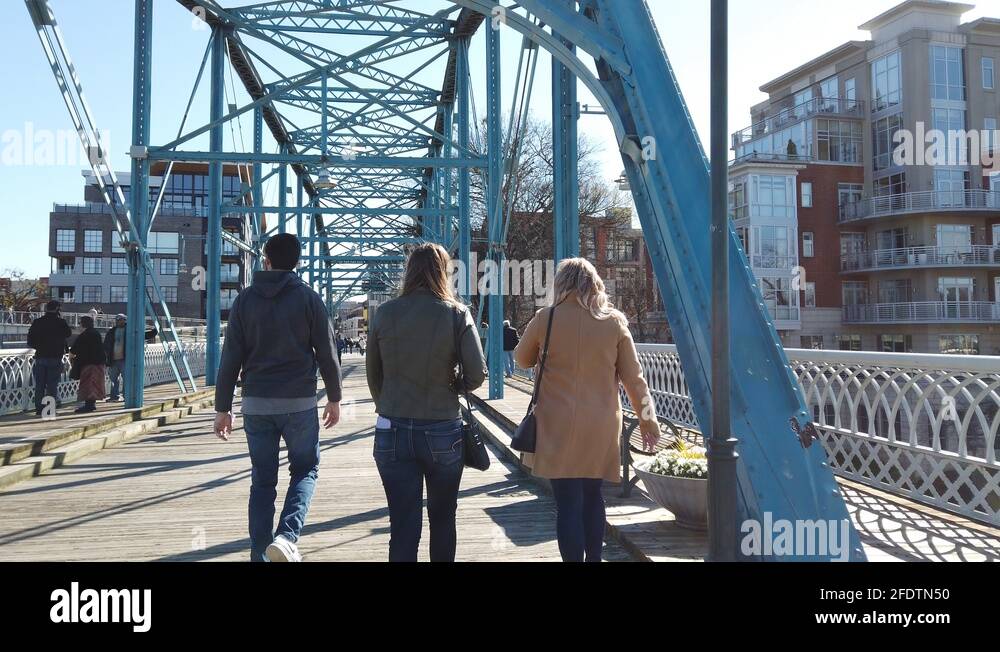 Walking Behind Group Of Three Friends Two Girls One Guy Walking Across ...