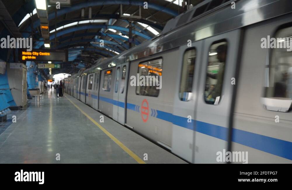 Modern Metro Train Arriving and Commuters Exiting at Station in Delhi ...