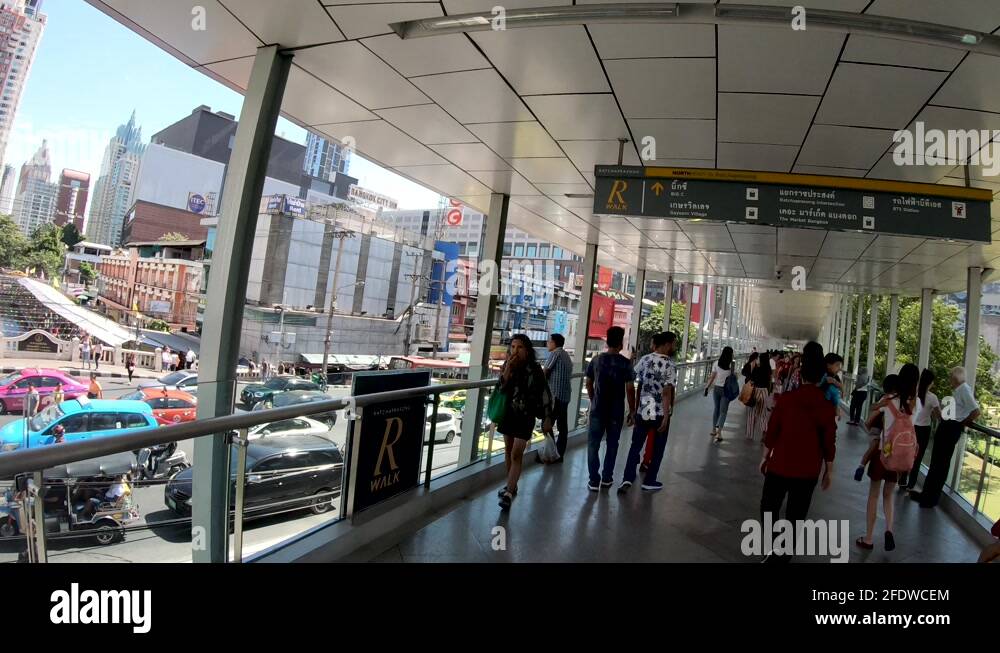 Ratchaprasong R Walk People walking on Ratchaprasong SkyWalk, aka R Walk, and heavy street ...