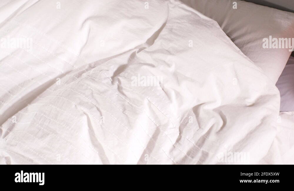 Woman lying in bed under sheet Stock Videos & Footage HD and 4K Video