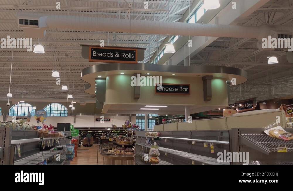 Wide shot Harris Teeter bread aisle empty and sold out due to