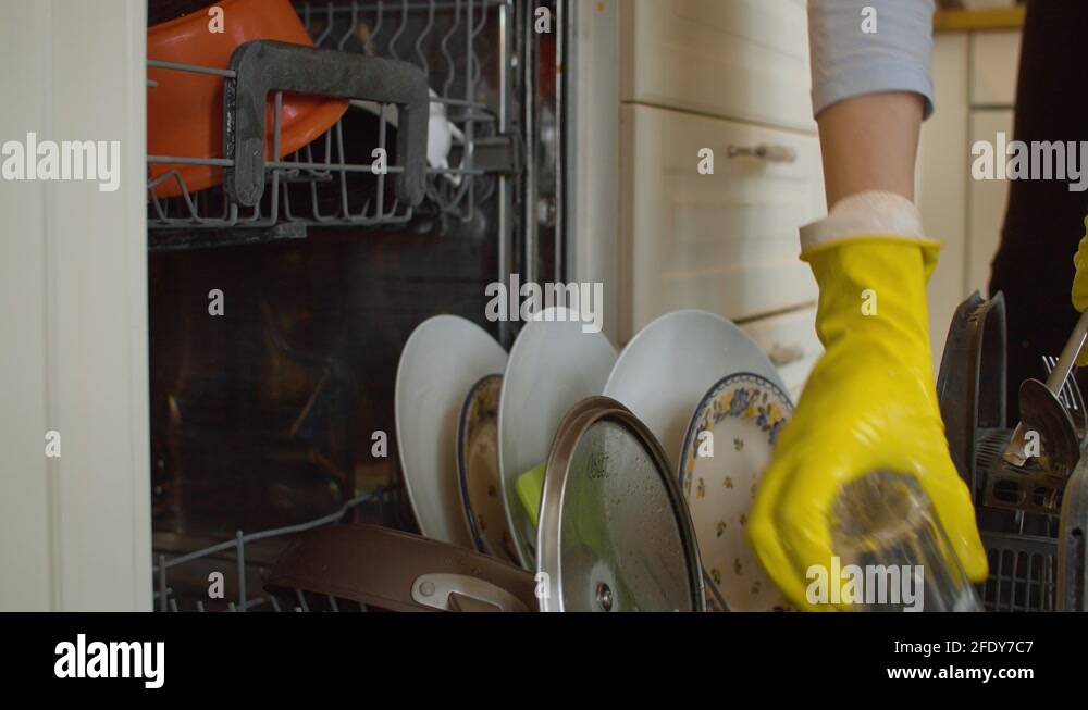 Loading dishwasher and closing it Stock Video Footage Alamy