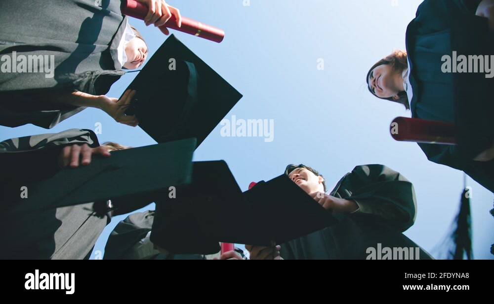 group happy graduates throw caps Stock Video Footage Alamy