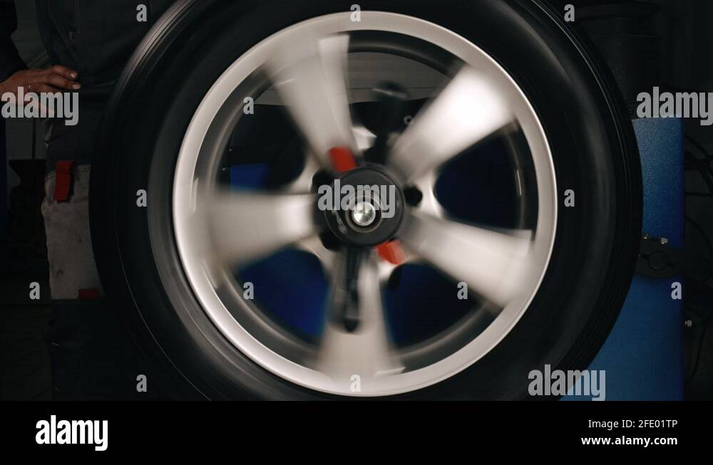 Balancing wheels in a service. Tire repair perform balancing wheels in
