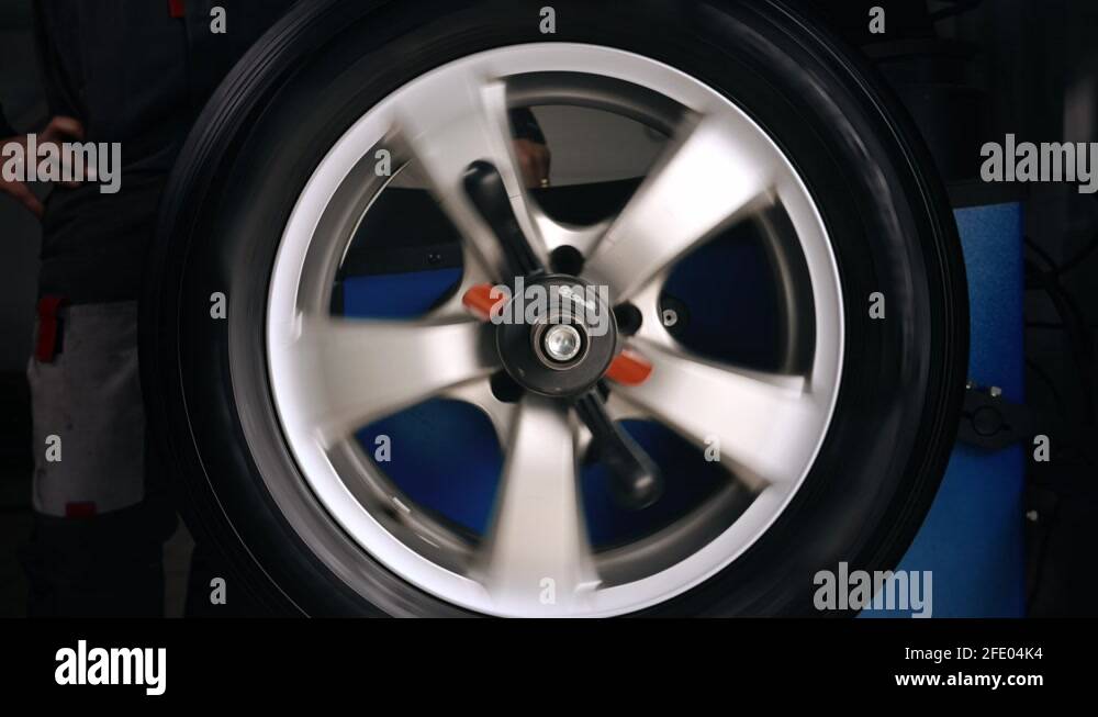 Balancing wheels in a service. Tire repair perform balancing wheels in