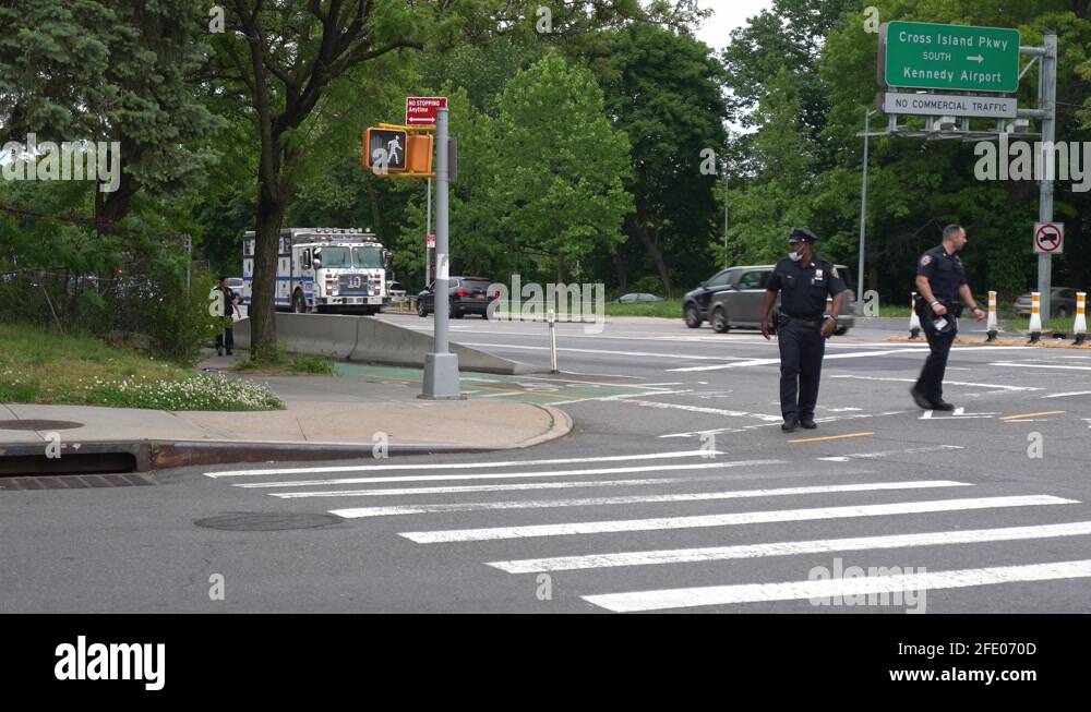 NYPD Officer walking and NYPD vehicles driving Stock Video Footage - Alamy