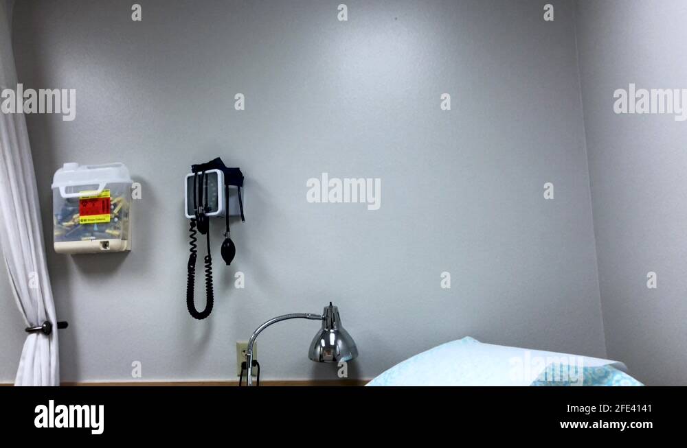 Doctors Office With An Examination Bed And A Wall Mounted Medical Tools