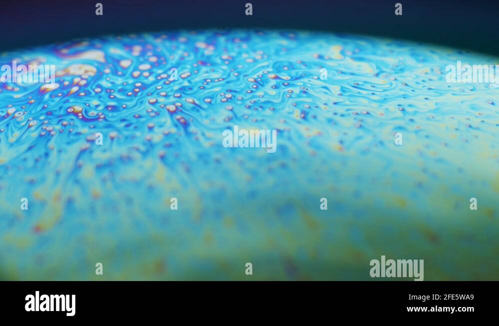 Fluid dynamics and light refraction diffraction in soap bubble surface