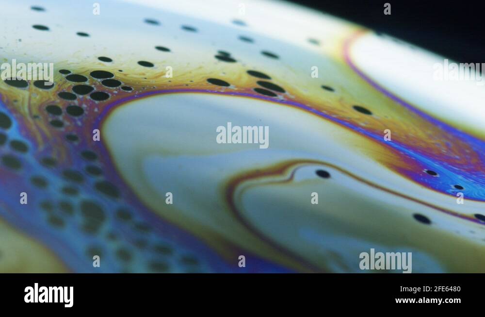 Fluid dynamics and light refraction diffraction in soap bubble surface