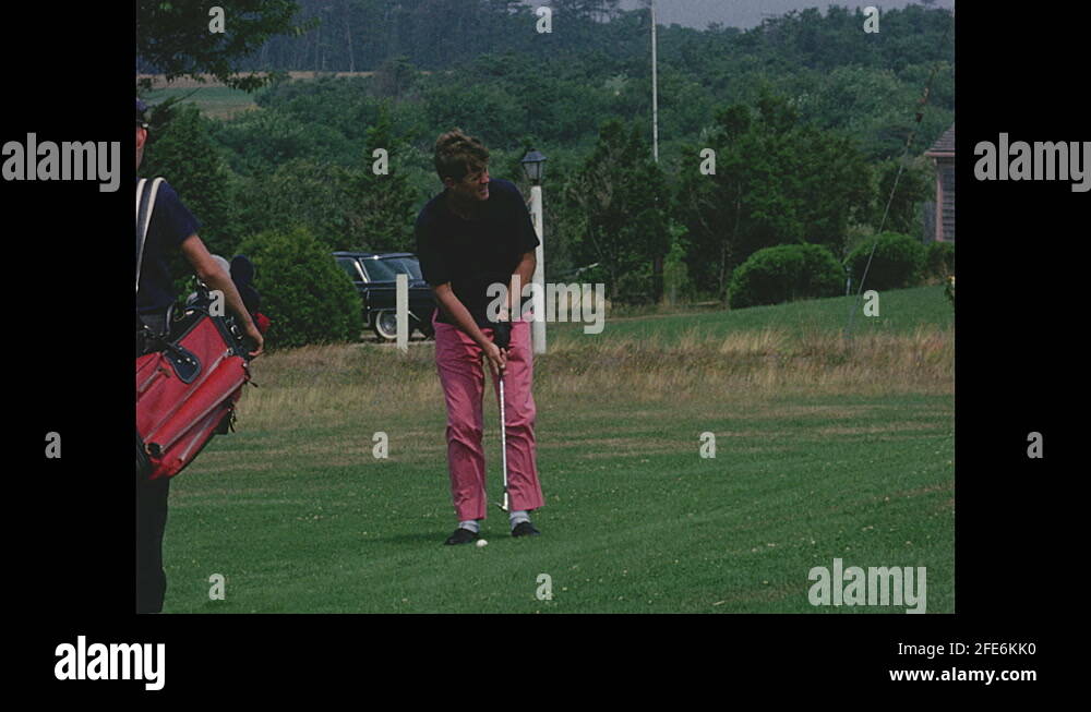 1960s Slow motion, John F Kennedy hitting golf ball Stock Video