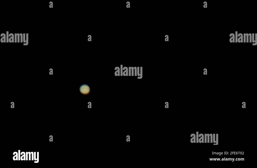 Jupiter as seen in backyard telescope large magnification with four