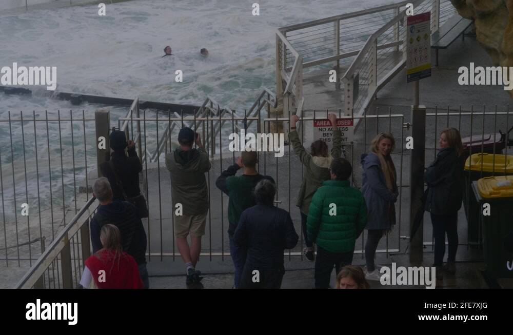 People Standing Behind Railing Australian People Standing Behind The Metal Railings By The Bronte ...