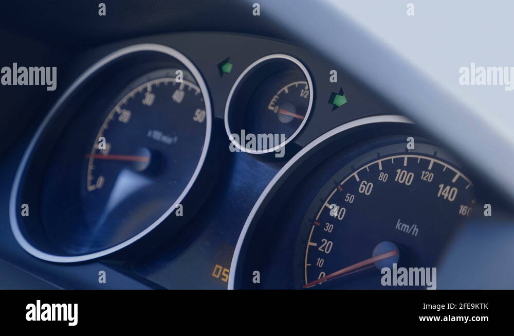 Green flashing arrows of hazard warning on the car dashboard indicate a