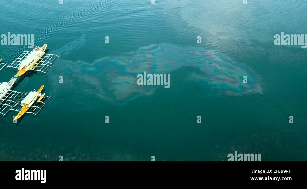 Marine pollution oil spill in beautiful tropical Coron Bay, Palawan Stock Video Footage Alamy