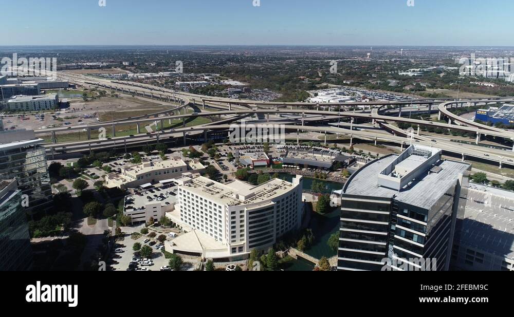 Aerial shot of buildings and highway around Dallas north Tollway and