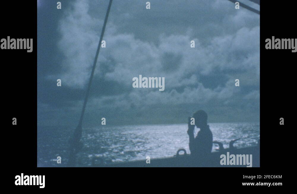 1960s Soldiers playing game of cards on deck. Silhouette of soldier