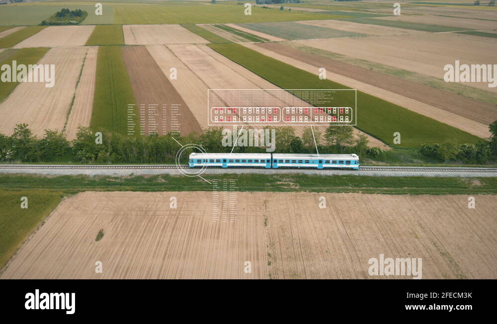 A train running on track amidst fields with animation of seating capacity Stock Video Footage