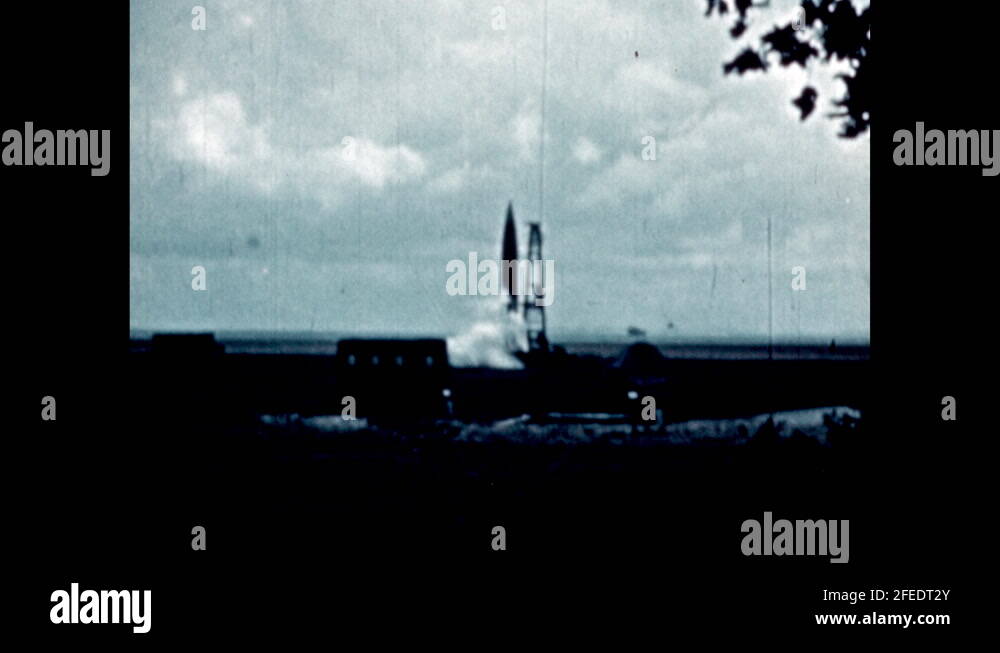 1950s: Title placard. Rocket launches from platform and flies into sky ...