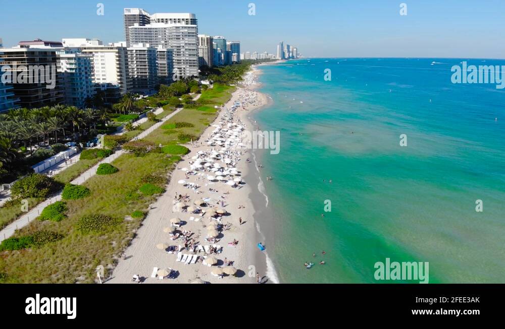 Very busy tourist beach packed as seen from above in Surfside Florida