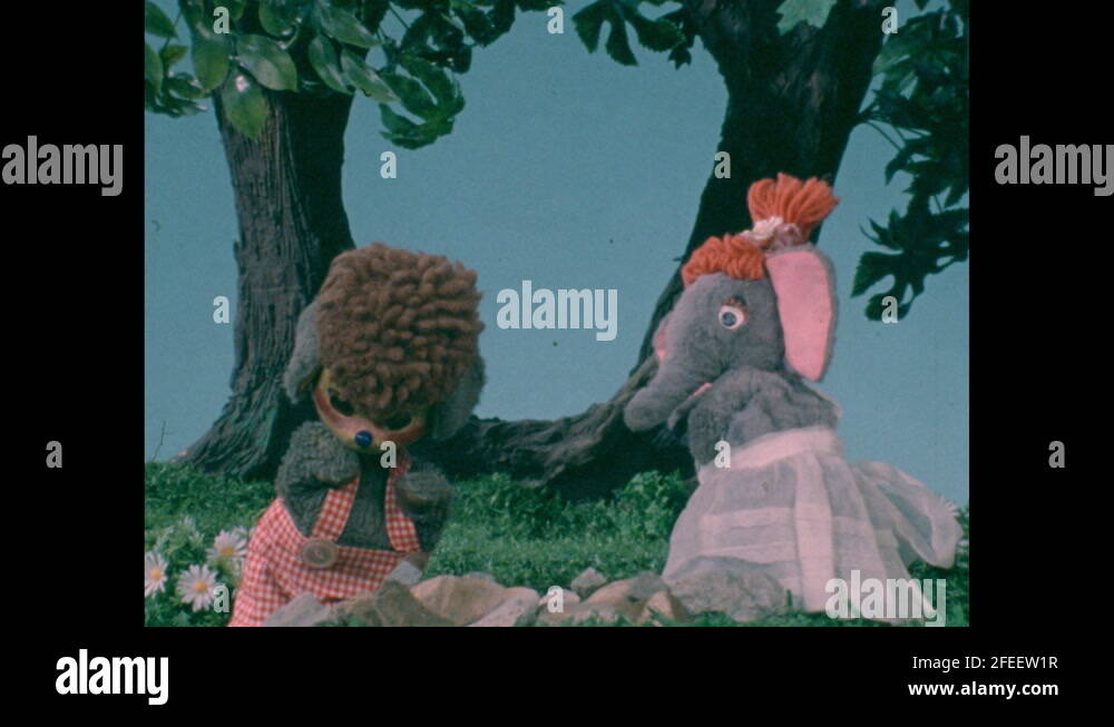 Puppet Show Rabbit Elephant 1970s: Mouse and elephant puppets look on forest floor and talk ...