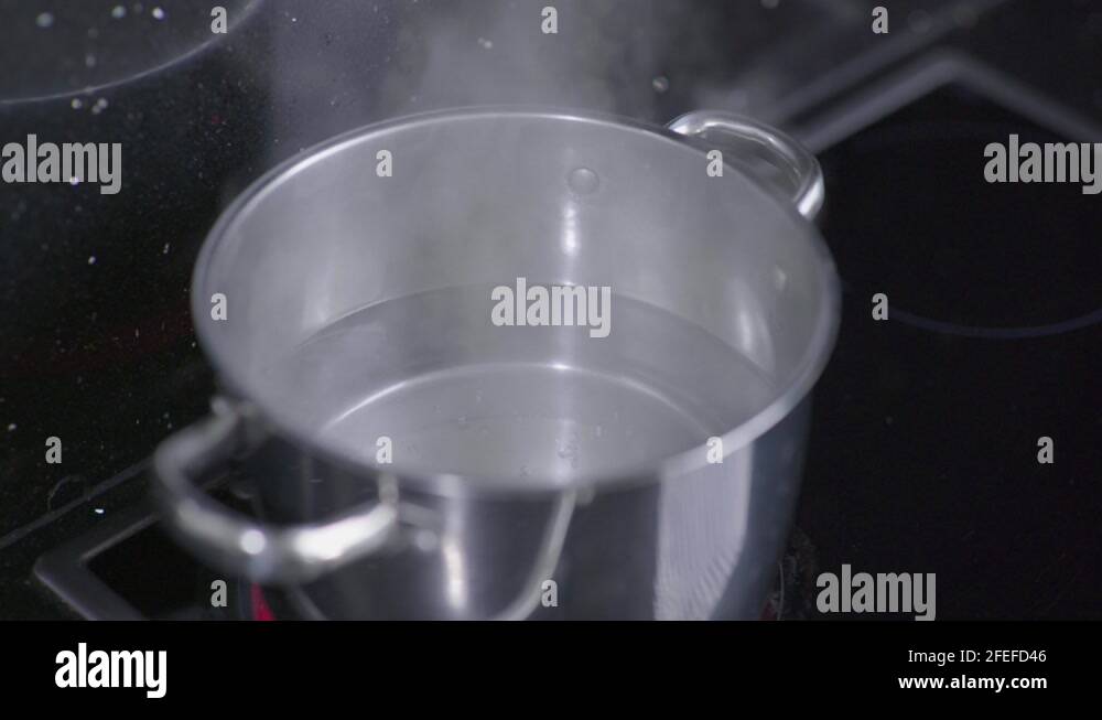 Boiling water pot stove Stock Videos & Footage HD and 4K Video Clips Alamy