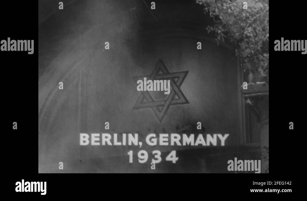 1940s: Nazi soldier smashes plaque with butt of gun. Building with Star ...