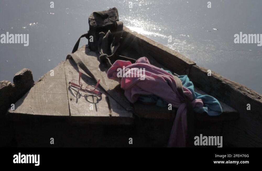 Old Boat front view with sun flares at a lake Stock Video Footage Alamy