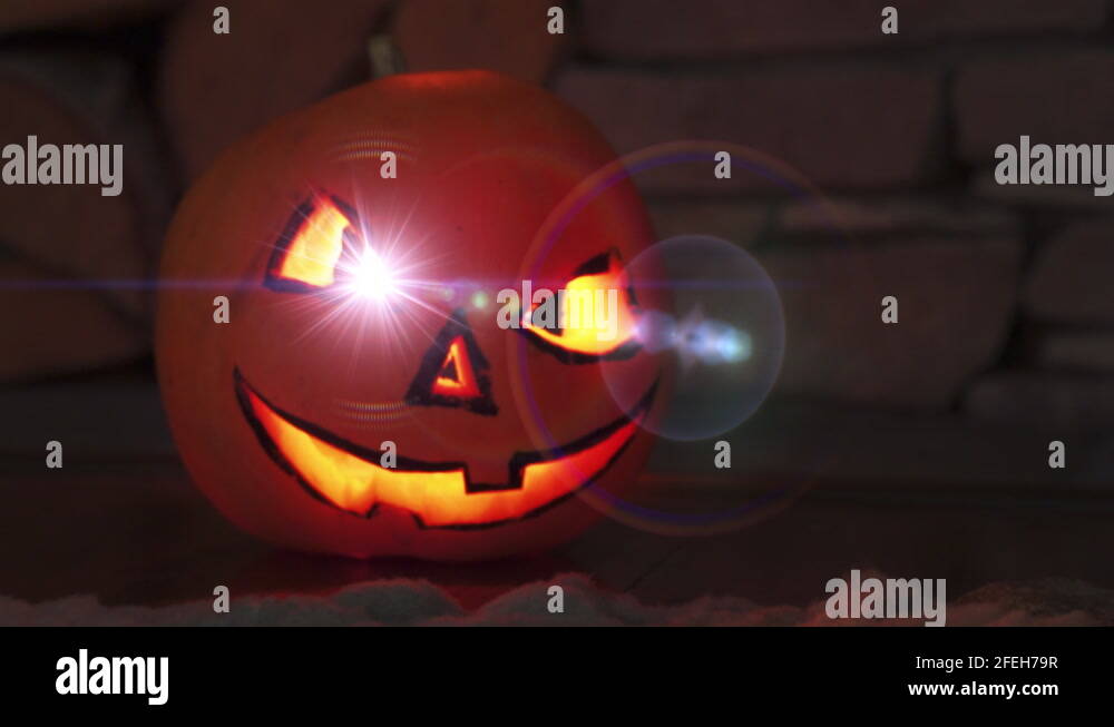 Jackolantern with lens flare eyes. Halloween pumpkin monster night