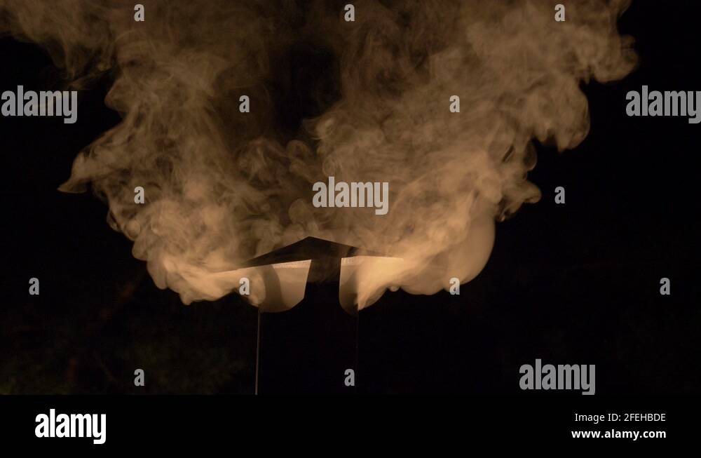 Clear Images Of Smoke Coming Out From A Traditional Charcoal Smoke